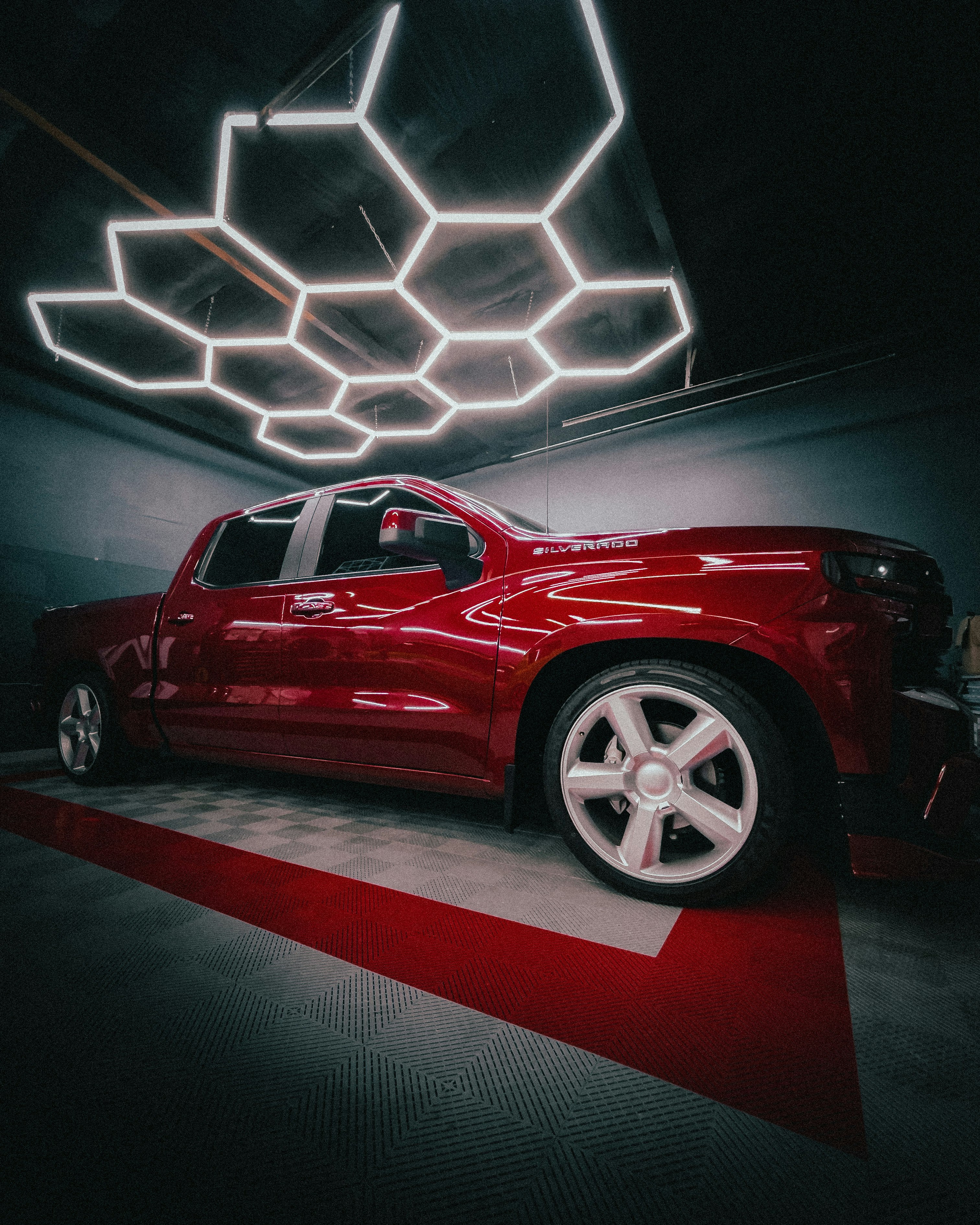 red chevrolet camaro in a room